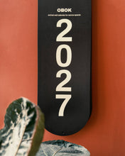 Load image into Gallery viewer, Obok - 2027 slim-line monthly wall calendar - Mat Cuk Design
