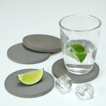 Load image into Gallery viewer, Drinks Coasters in cast concrete - a set of four
