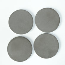 Load image into Gallery viewer, Drinks Coasters in cast concrete - a set of four
